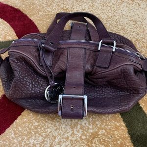 Small purple leather Michael Kors purse.